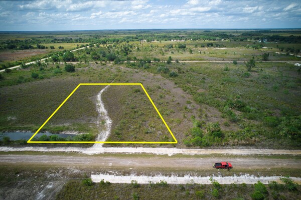 Mostly Clear 1.5-Acre Lot With Power Next Door & Great Road Access !!
